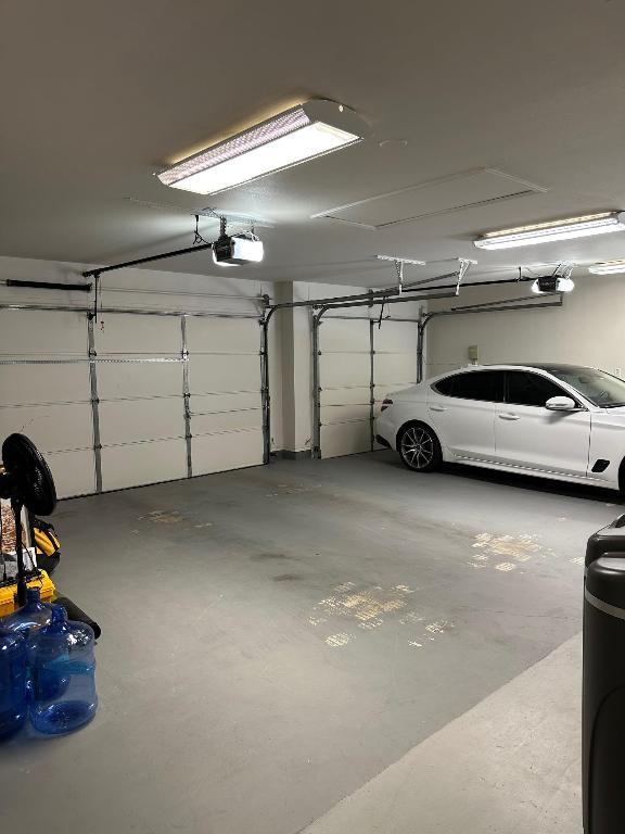 2520 Butler National Dr, Pflugerville, TX 78660 - garage featuring a garage door opener
