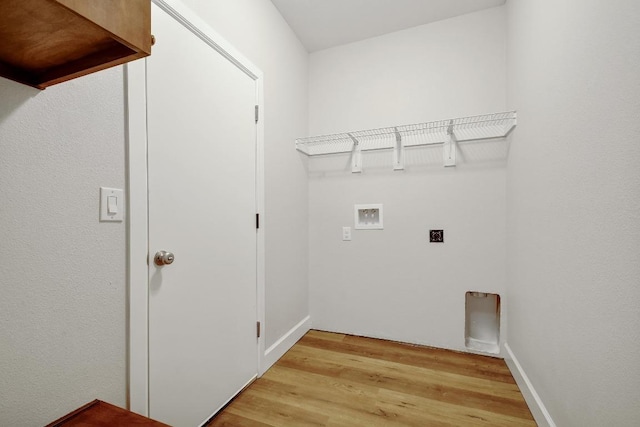 2109 Meadow View Dr, San Marcos, TX 78666 - washroom featuring hookup for an electric dryer, washer hookup, and light wood finished floors