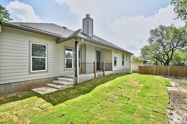 2109 Meadow View Dr, San Marcos, TX 78666 - back of property with a chimney and roof with shingles