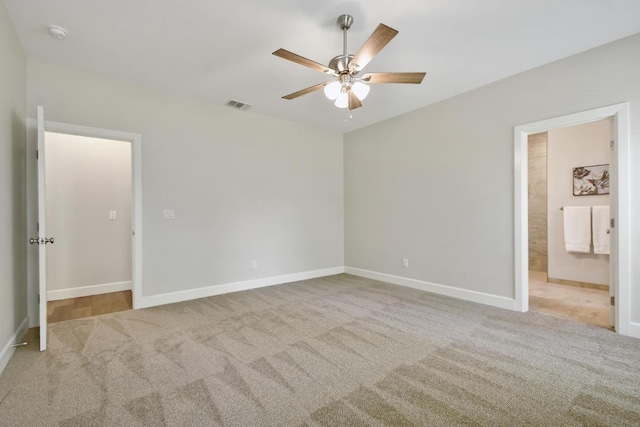 2109 Meadow View Dr, San Marcos, TX 78666 - unfurnished bedroom with carpet flooring, ceiling fan, and connected bathroom
