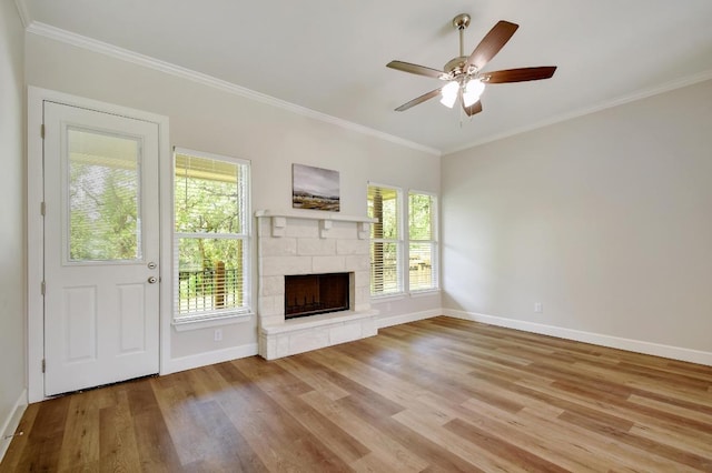 2109 Meadow View Dr, San Marcos, TX 78666 - unfurnished living room with wood finished floors, ornamental molding, a stone fireplace, and ceiling fan