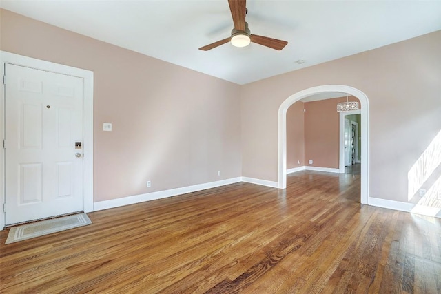 4412 Red River St, Austin, TX 78751 - spare room with arched walkways, ceiling fan, and wood finished floors