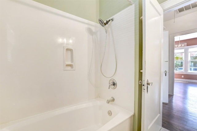 4412 Red River St, Austin, TX 78751 - bathroom featuring shower / tub combination and wood finished floors