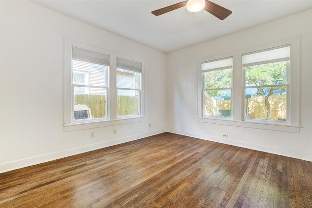 4412 Red River St, Austin, TX 78751 - spare room featuring wood-type flooring, plenty of natural light, and a ceiling fan