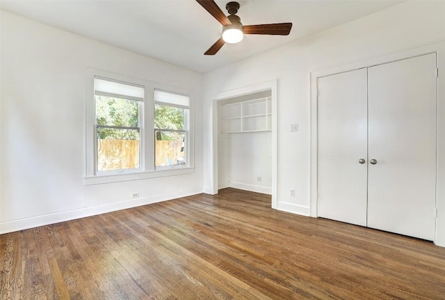 4412 Red River St, Austin, TX 78751 - unfurnished bedroom with multiple closets, wood finished floors, and a ceiling fan