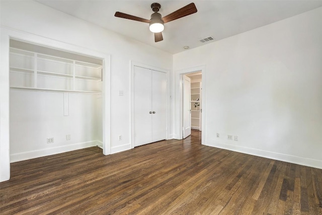 4412 Red River St, Austin, TX 78751 - unfurnished bedroom featuring wood finished floors, two closets, and ceiling fan