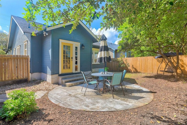 4412 Red River St, Austin, TX 78751 - rear view of house featuring entry steps, a patio, and a fenced backyard