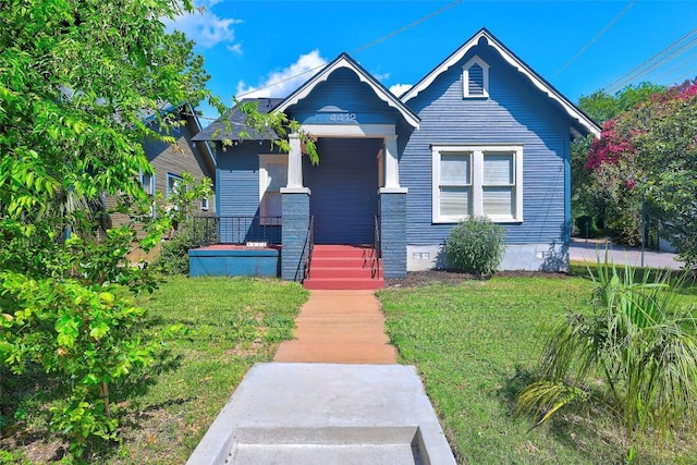 4412 Red River St, Austin, TX 78751 - view of front of home with covered porch, a front lawn, and crawl space