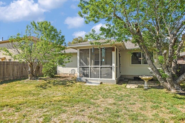 1141 Stone Forest Trl, Round Rock, TX 78681 - rear view of house featuring a sunroom