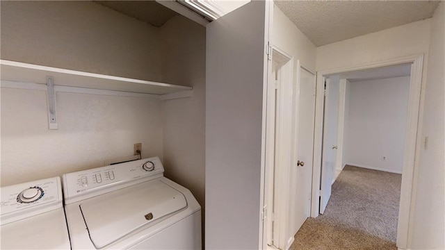 washroom with washing machine and dryer and carpet