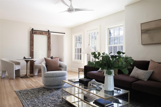 1904 Meadowbrook Dr, Austin, TX 78703 - living room with a barn door, a ceiling fan, and wood finished floors