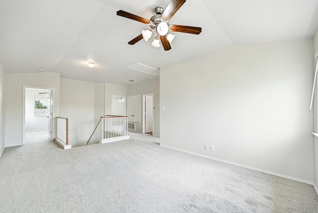 1921 Sand Creek Rd, Cedar Park, TX 78613 - spare room with attic access, lofted ceiling, light carpet, and ceiling fan