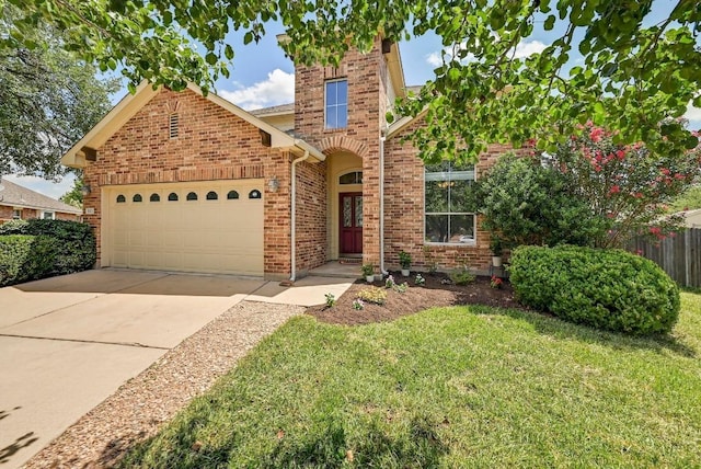 1921 Sand Creek Rd, Cedar Park, TX 78613 - traditional-style home featuring an attached garage, concrete driveway, and brick siding