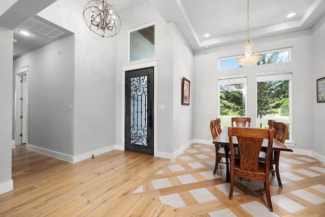 2250 Meritage, New Braunfels, TX 78132 - entryway featuring a chandelier, a towering ceiling, light wood-style floors, and recessed lighting
