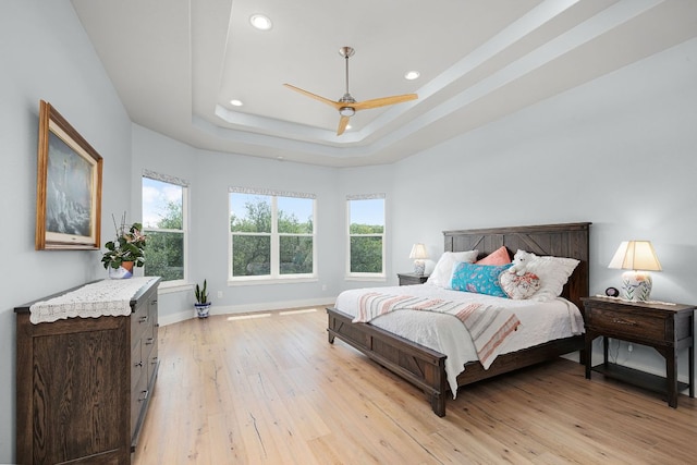 2250 Meritage, New Braunfels, TX 78132 - bedroom with light wood-style floors, recessed lighting, a raised ceiling, and a ceiling fan