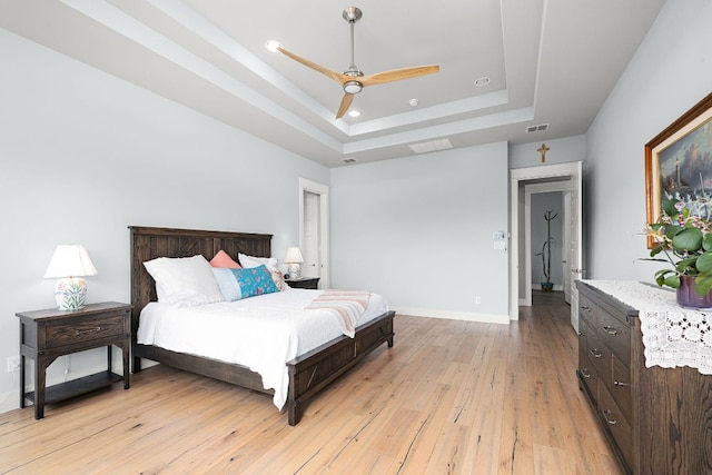 2250 Meritage, New Braunfels, TX 78132 - bedroom with a tray ceiling, light wood-type flooring, and ceiling fan