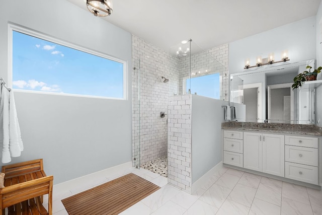 2250 Meritage, New Braunfels, TX 78132 - bathroom featuring a tile shower, vanity, and marble look tiles