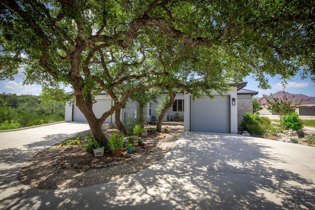 2250 Meritage, New Braunfels, TX 78132 - obstructed view of property with concrete driveway, an attached garage, and stone siding