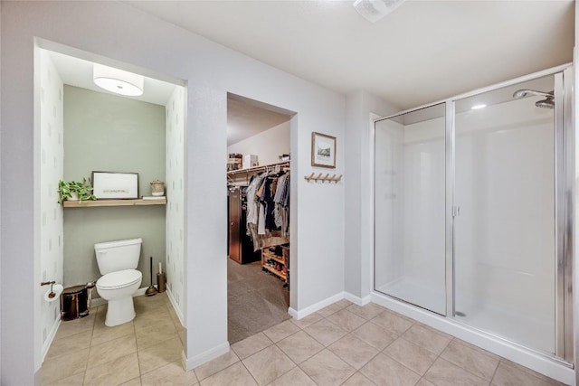 605 Liard River Rd, Hutto, TX 78634 - bathroom with a shower stall, tile patterned floors, and a walk in closet