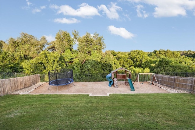 605 Liard River Rd, Hutto, TX 78634 - view of play area with a trampoline and a fenced backyard