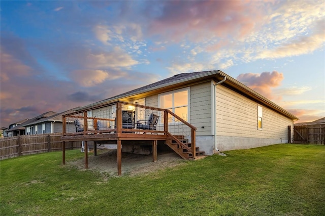 605 Liard River Rd, Hutto, TX 78634 - back of house featuring a fenced backyard, a deck, and stairs