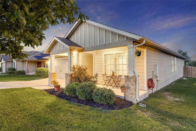605 Liard River Rd, Hutto, TX 78634 - view of front of home with board and batten siding, a garage, and driveway