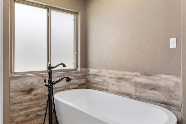 8305 Split Trail Cv, Temple, TX 76502 - full bath with a freestanding tub and a textured wall