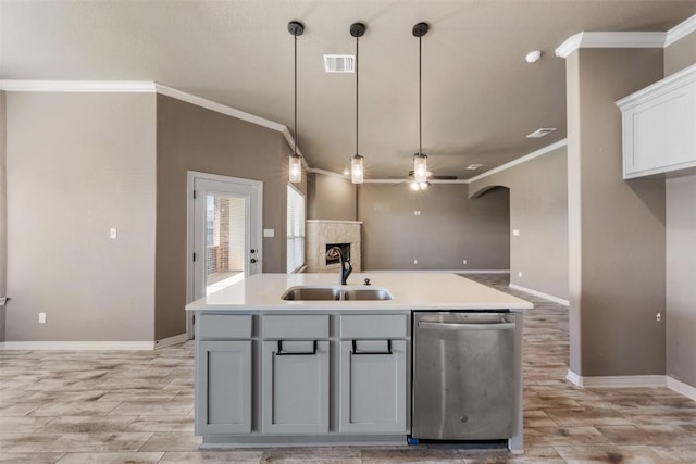 8305 Split Trail Cv, Temple, TX 76502 - kitchen featuring dishwasher, ceiling fan, light wood-style floors, ornamental molding, and a fireplace