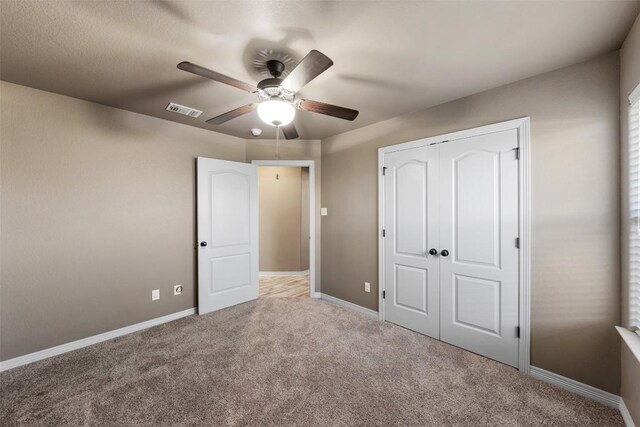 8305 Split Trail Cv, Temple, TX 76502 - unfurnished bedroom featuring carpet floors, a closet, and a ceiling fan