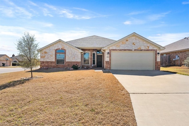 8305 Split Trail Cv, Temple, TX 76502 - french country inspired facade featuring brick siding, a garage, driveway, and a shingled roof