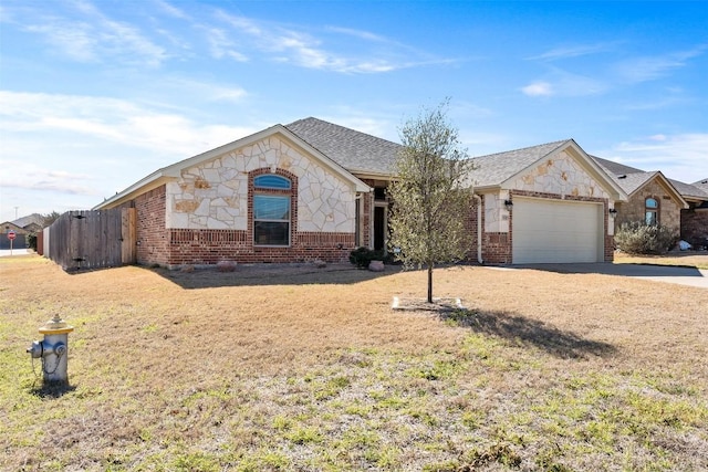 8305 Split Trail Cv, Temple, TX 76502 - view of front of property with brick siding, an attached garage, concrete driveway, and stone siding