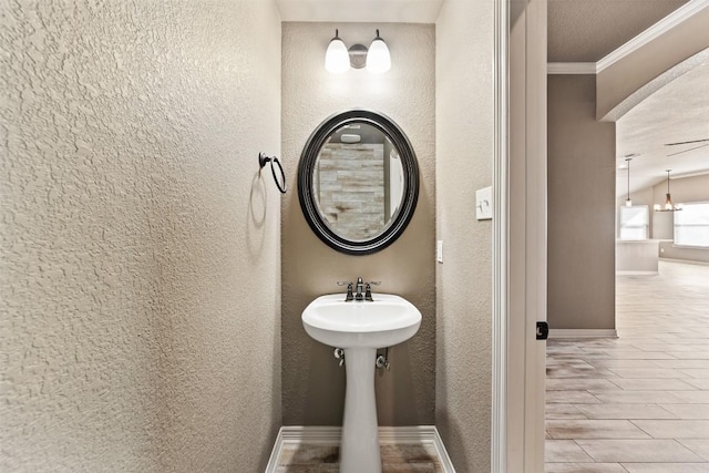 8305 Split Trail Cv, Temple, TX 76502 - bathroom with ornamental molding, a textured wall, and wood finished floors