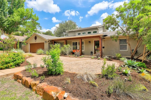 4104 Honeycomb Rock Cir, Austin, TX 78731 - view of front of house featuring a garage, a porch, and driveway