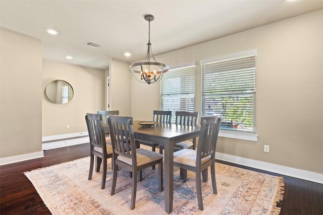 4104 Honeycomb Rock Cir, Austin, TX 78731 - dining area with a chandelier, wood finished floors, and recessed lighting