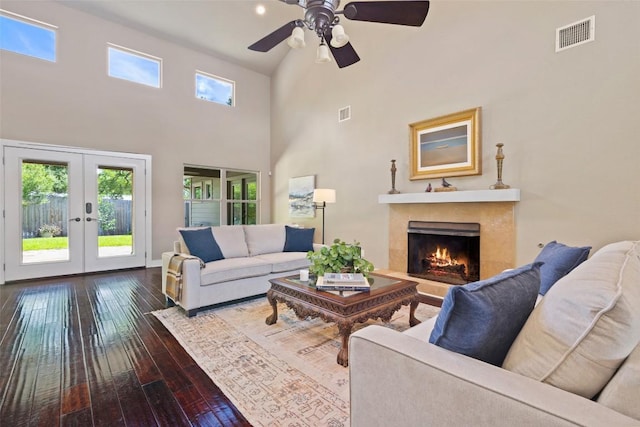4104 Honeycomb Rock Cir, Austin, TX 78731 - living area with french doors, hardwood / wood-style floors, a towering ceiling, a fireplace, and ceiling fan