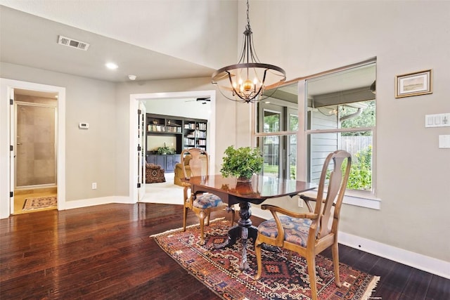 4104 Honeycomb Rock Cir, Austin, TX 78731 - dining area featuring a chandelier, dark wood-type flooring, and recessed lighting