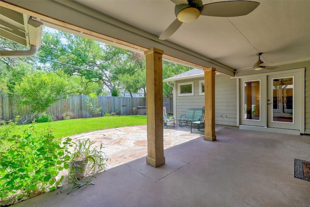 4104 Honeycomb Rock Cir, Austin, TX 78731 - fenced backyard with french doors, a ceiling fan, and a patio