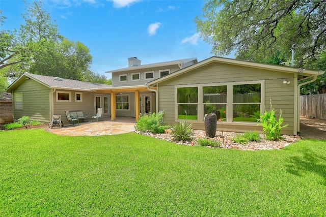 4104 Honeycomb Rock Cir, Austin, TX 78731 - back of property featuring a chimney and a patio