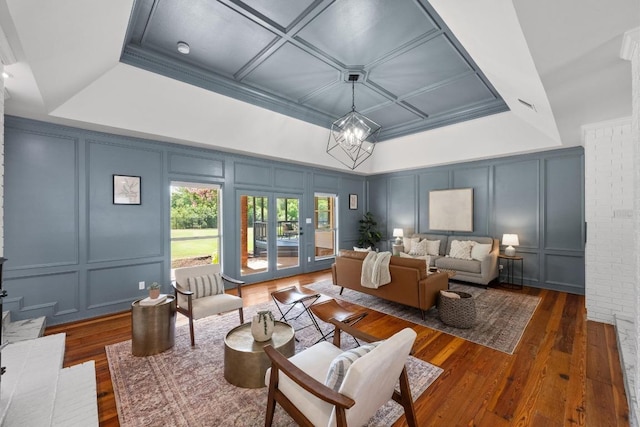 3501 Lost Pine Cv, Austin, TX 78739 - living room with a decorative wall, hardwood / wood-style flooring, and a chandelier