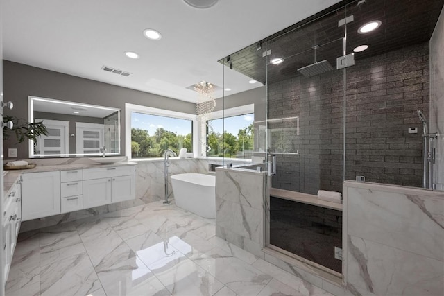 3501 Lost Pine Cv, Austin, TX 78739 - full bath featuring vanity, a shower stall, recessed lighting, a freestanding bath, and marble finish flooring