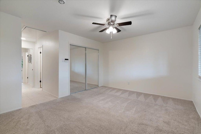 8432 Antero Dr, Austin, TX 78759 - unfurnished bedroom featuring attic access, carpet flooring, a closet, and ceiling fan