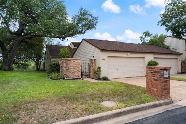 8432 Antero Dr, Austin, TX 78759 - view of property exterior featuring a yard, a garage, and driveway