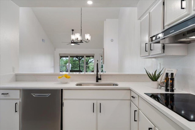 8432 Antero Dr, Austin, TX 78759 - kitchen with black electric stovetop, under cabinet range hood, a chandelier, white cabinetry, and lofted ceiling