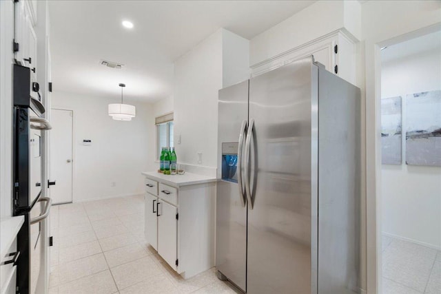 8432 Antero Dr, Austin, TX 78759 - kitchen featuring stainless steel fridge with ice dispenser, white cabinets, light countertops, hanging light fixtures, and light tile patterned flooring
