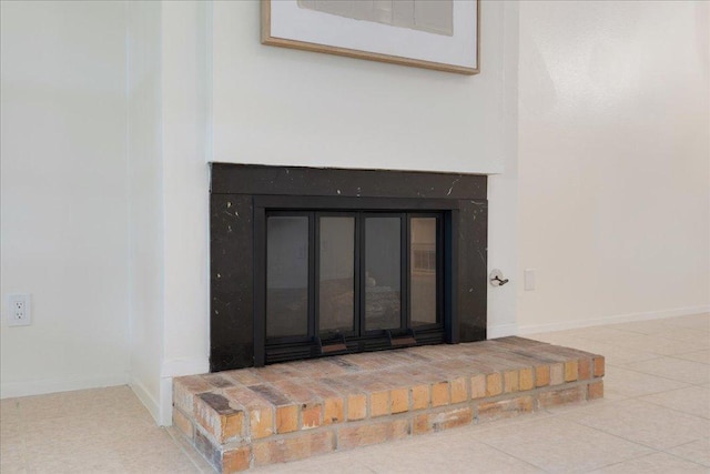 8432 Antero Dr, Austin, TX 78759 - detailed view of a glass covered fireplace and baseboards