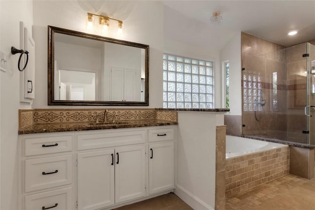 790 Enchanted Oaks Dr, Driftwood, TX 78619 - bathroom featuring a stall shower, vanity, a garden tub, and tile patterned flooring