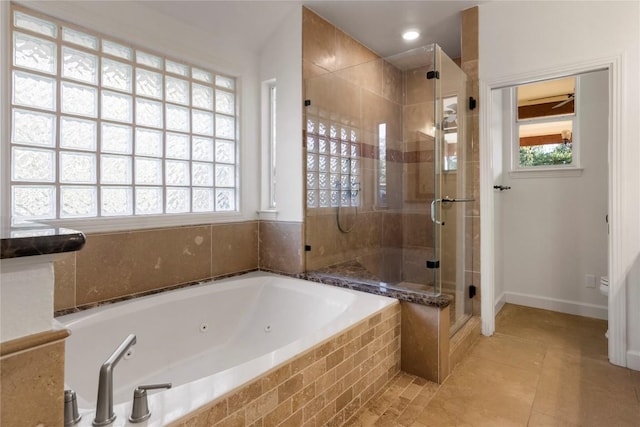 790 Enchanted Oaks Dr, Driftwood, TX 78619 - full bathroom with a stall shower, a jetted tub, and tile patterned flooring