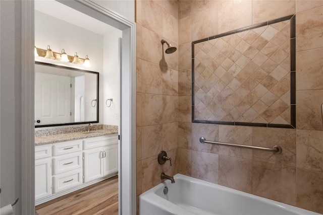 790 Enchanted Oaks Dr, Driftwood, TX 78619 - bathroom with vanity, tub / shower combination, and wood finished floors