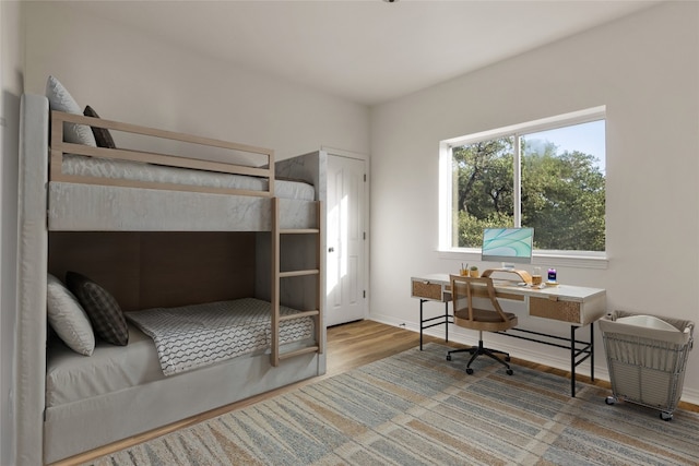 790 Enchanted Oaks Dr, Driftwood, TX 78619 - bedroom with wood finished floors and an office area