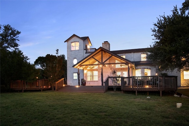 790 Enchanted Oaks Dr, Driftwood, TX 78619 - rear view of property featuring a chimney, a yard, and a wooden deck